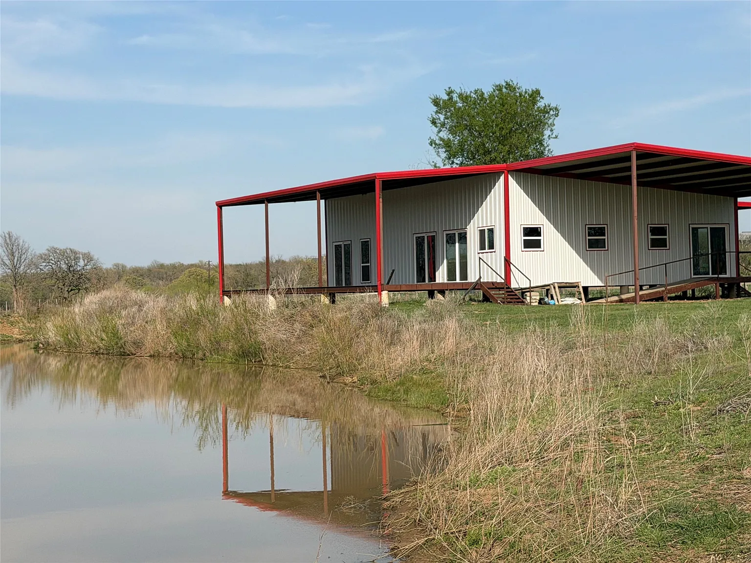Your Texas Dream Awaits: A Barndominium Shell on 10.8 Acres with a Private Pond