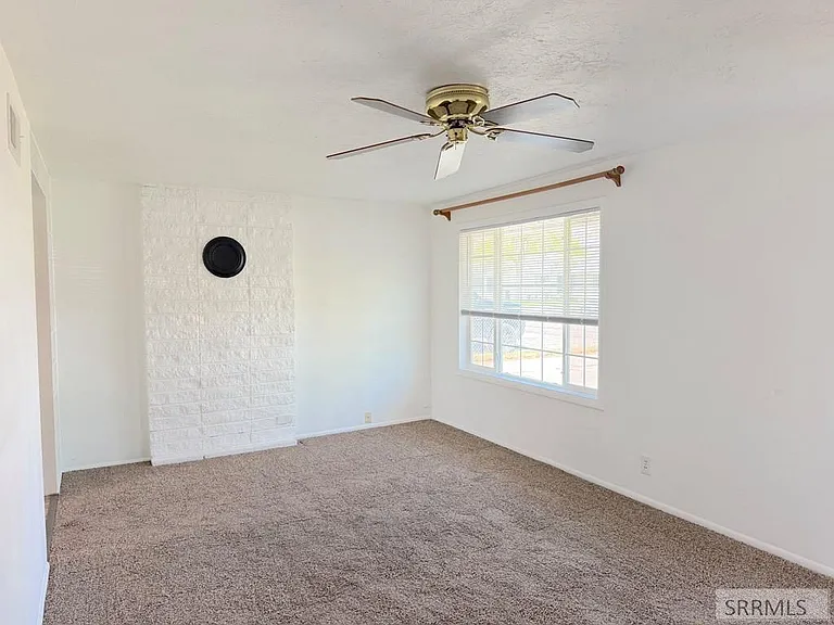 Bright bedroom with window and carpet