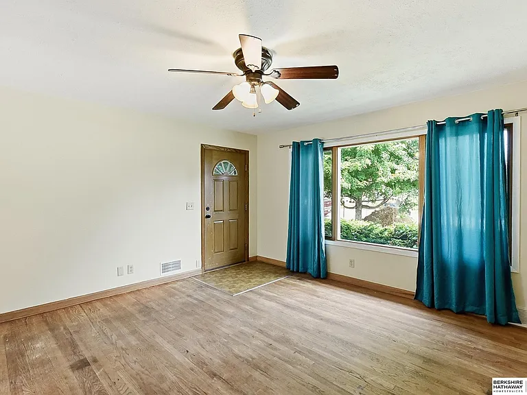 Freshly painted living room with wood floors