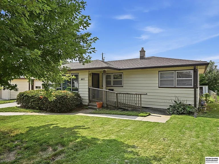 Side exterior and accessible entrance ramp