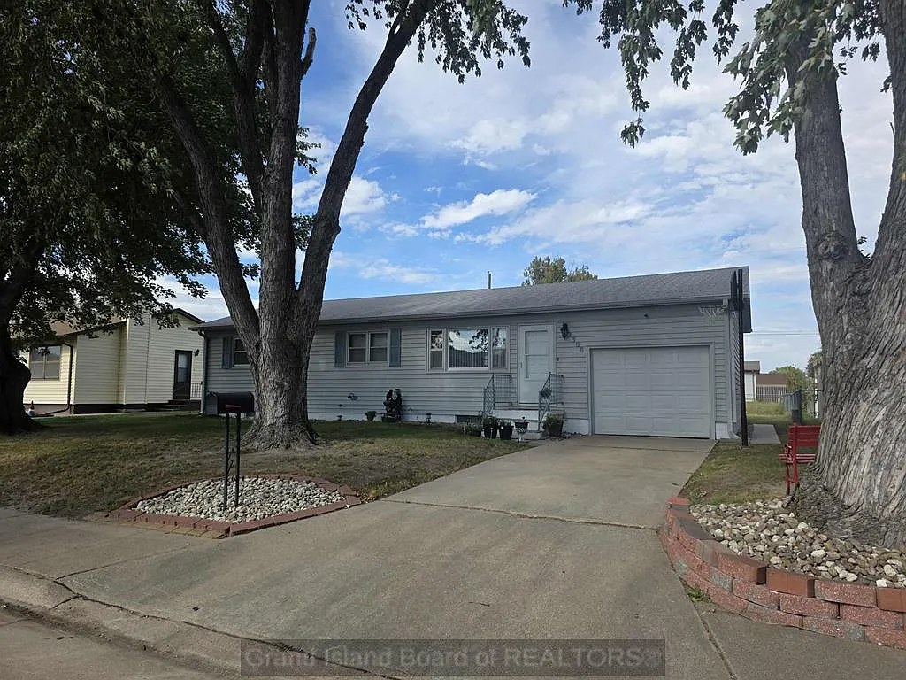 Grand Island Gem: Versatile Ranch Home with Income Potential