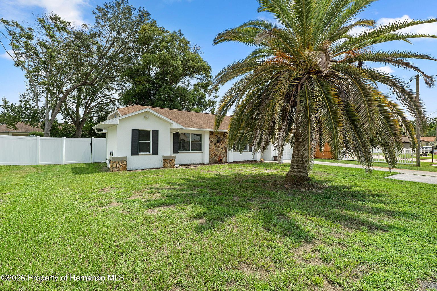 This $255K Spring Hill Home Has Two Full Baths and a Screened Porch