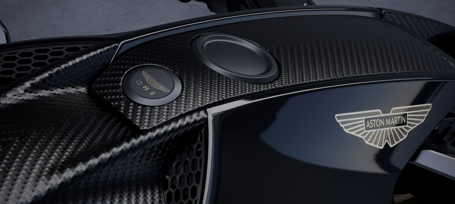 Aston Martin badge and carbon-fiber detail on the AMB 002