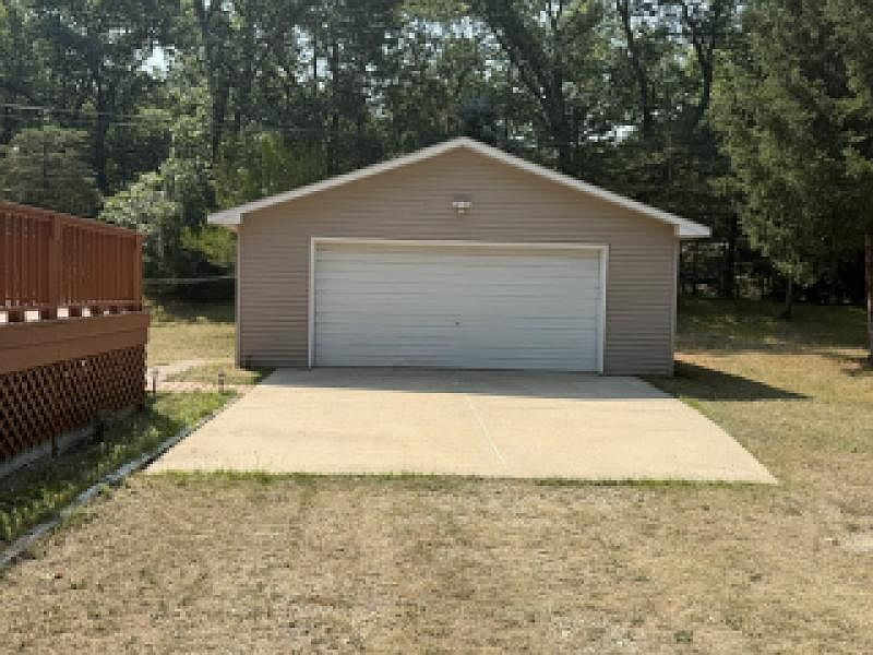 Oversized detached garage beside the home