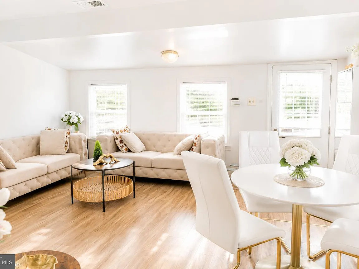 Bright combined living and dining room inside the 528-square-foot bungalow
