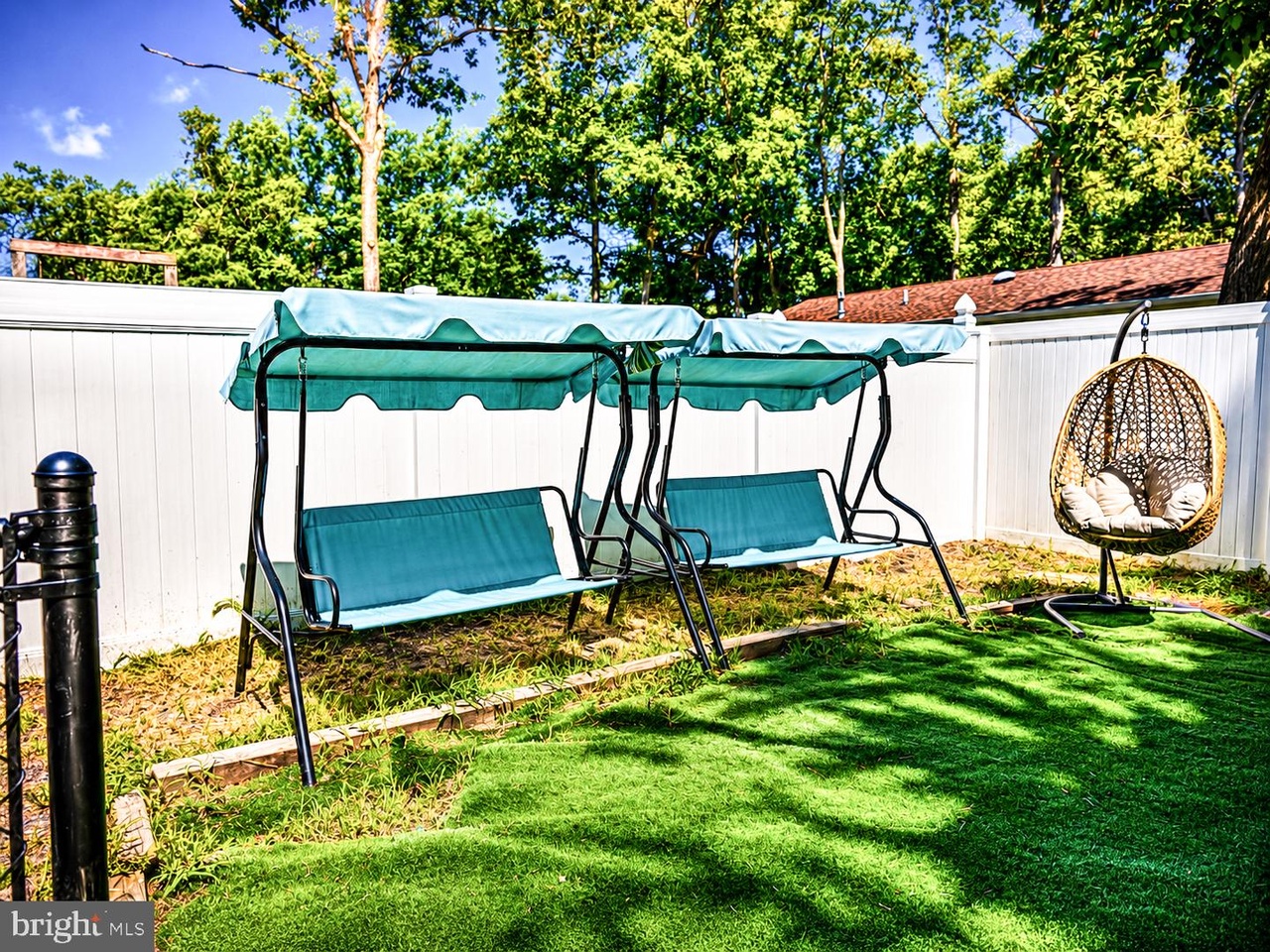 Fenced backyard with patio furniture and outdoor seating