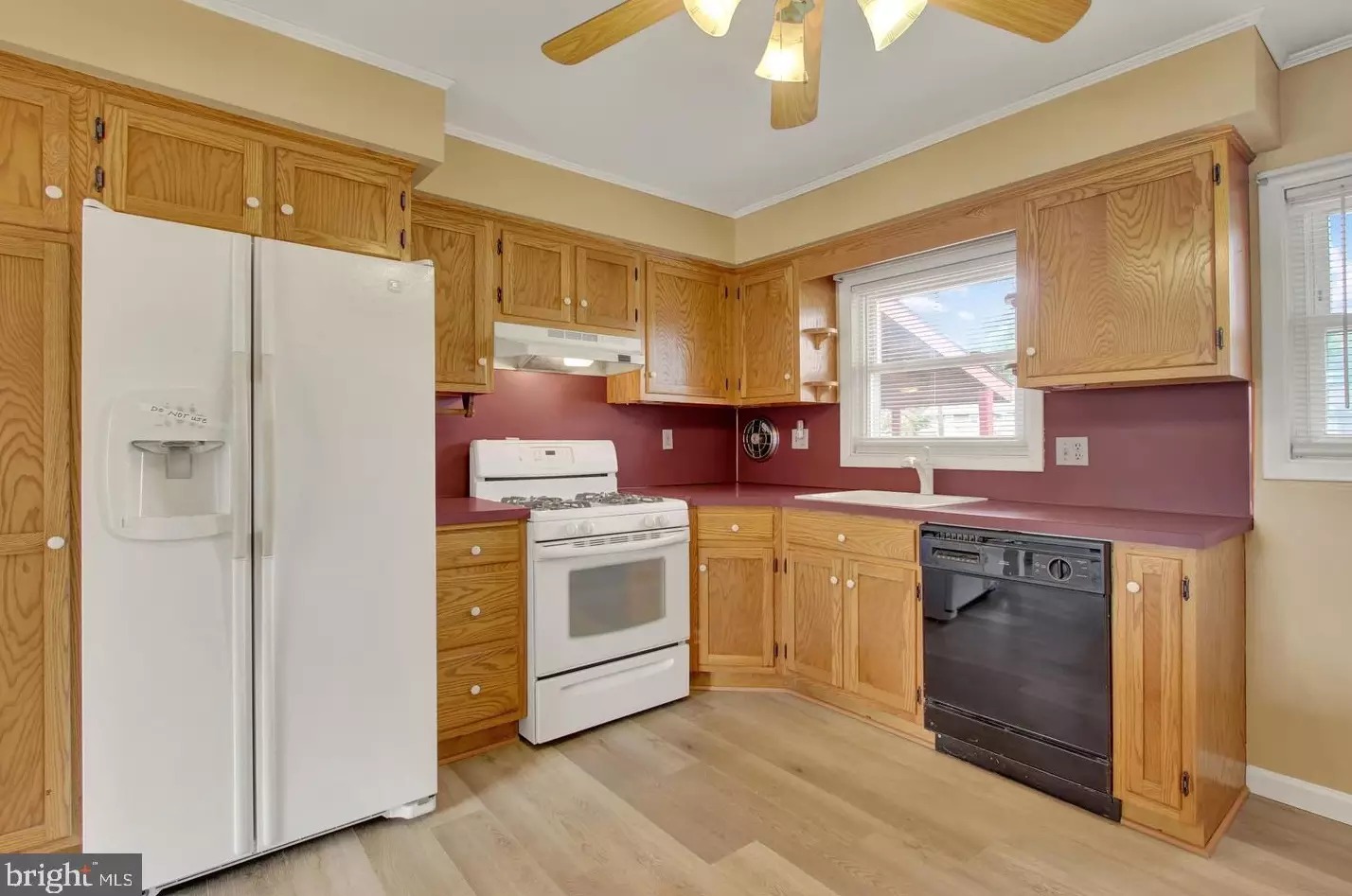 Kitchen with wood cabinets and vinyl flooring